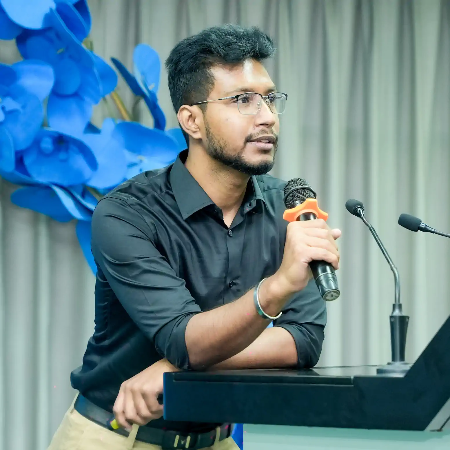 HM Nayem speaking at an event